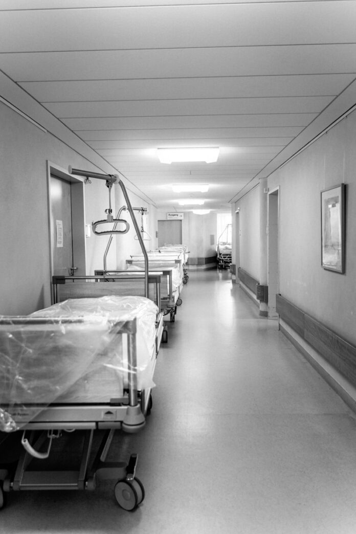 Photo by Ante Samarzija white hospital bed in a room