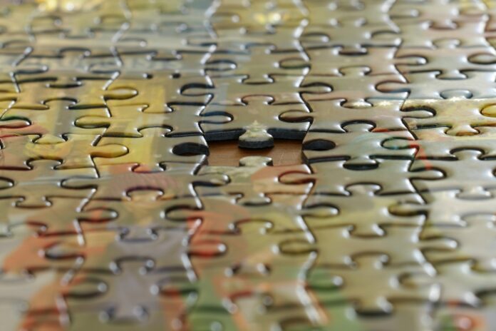 Photo by Pierre Bamin a close up view of a puzzle piece