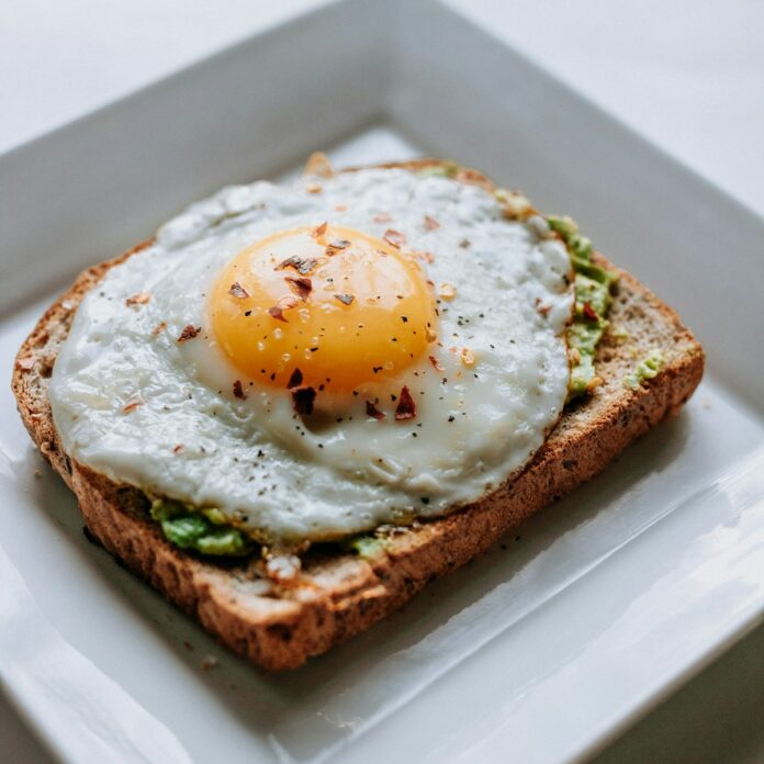 Photo by Ben Kolde bread with sunny side-up egg served on white ceramic plate
