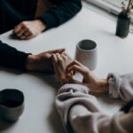 바쁜 일상 속 여성 건강, 작은 실천으로 지키세요 person in black long sleeve shirt holding white ceramic mug