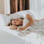 수면, 이제는 ‘질’이 중요하다…한국인의 숙면 루틴은? a person lying in a bed